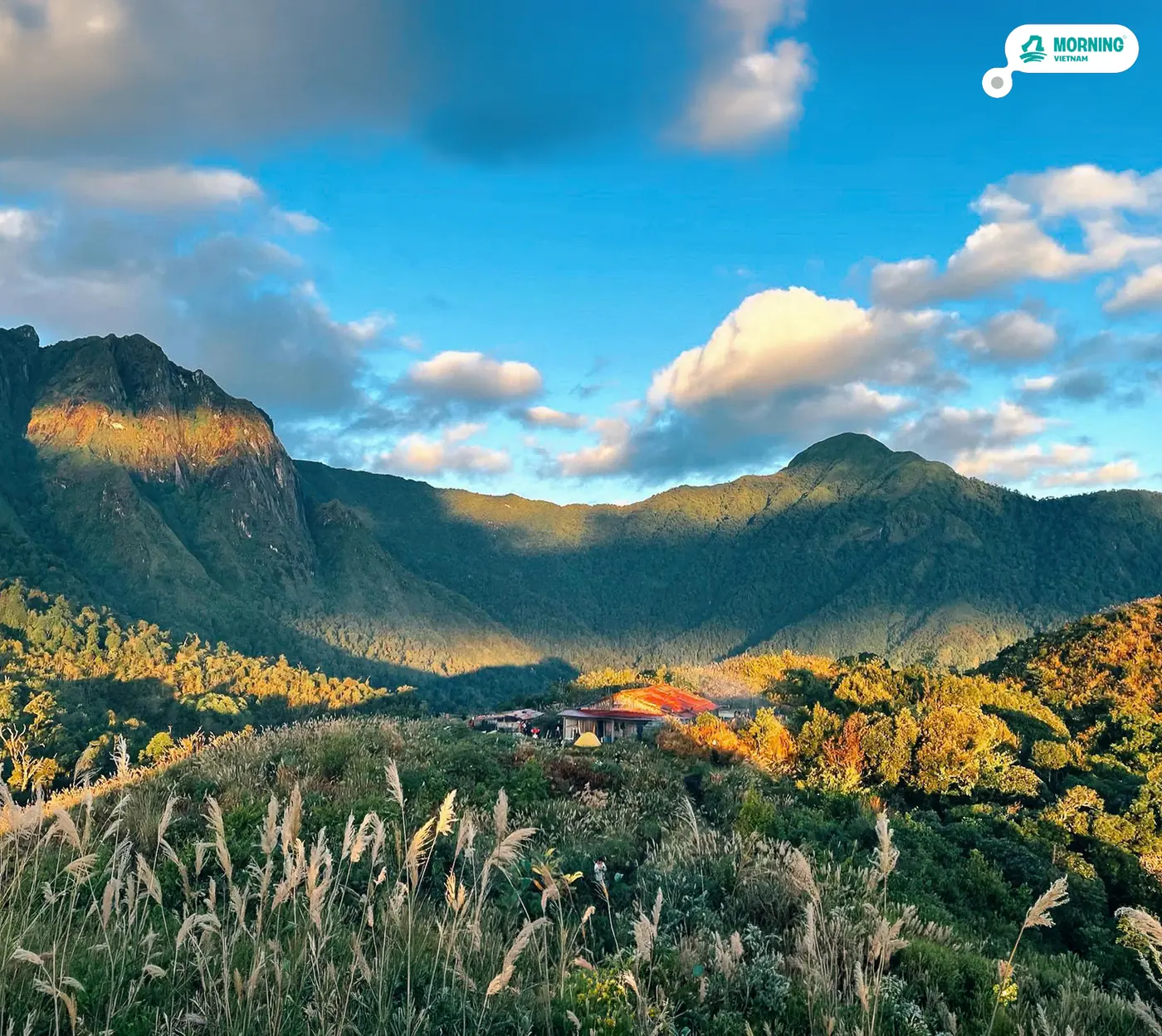 Núi Muối hut in a golden valley under a blue sky